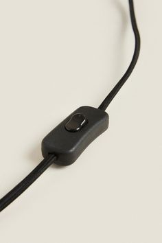 a black cord connected to an electronic device