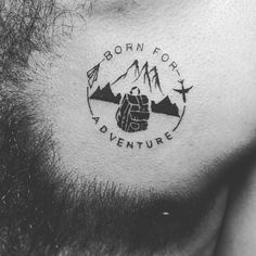 a man's chest with the words born for adventure on it and mountains in the background