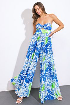 A printed woven jumpsuit featuring sweetheart neckline, center cut out, pleated pant and smocked back bodiceDetails:Self : 100% PolyesterLining : 100% PolyesterSize & Fit- Model is 5`9" And Wearing Size Small- Measurements Taken From Size Small- Approx. Length: 52" Blue Jumpsuits And Rompers With Smocked Back For Beach, Blue Sleeveless Jumpsuit With Smocked Back, Sleeveless Blue Jumpsuit With Smocked Back, Blue Summer Jumpsuits With Elastic Waistband, Blue Summer Jumpsuits And Rompers With Elastic Waistband, Blue Jumpsuit With Smocked Back, Blue Wide-leg Jumpsuits And Rompers For Day Out, Wide Leg Blue Jumpsuit For Day Out, Blue Jumpsuit With Elastic Waistband For Vacation