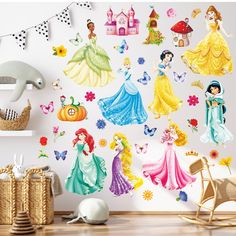 there are many princesses on the wall in this room