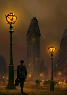 a man is walking down the street at night in front of tall buildings with lights on them