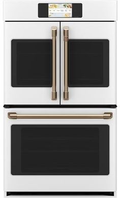 the double oven is white with gold trimmings and two doors on each side