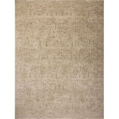 a beige rug with an intricate design on it