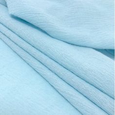 the light blue sheets are folded together