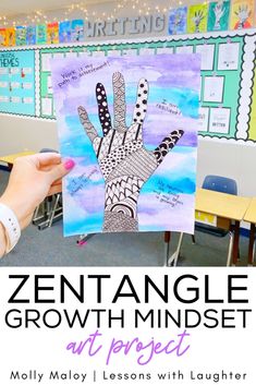 a person holding up a piece of art with the words,'zentanglele growth minds