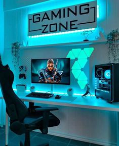 a gaming desk with a monitor, keyboard and mouse in front of the sign that says gaming zone