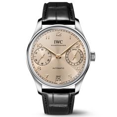 The origins of the Portugieser date back to the late 1930s, when IWC Schaffhausen used a high-precision pocket watch movement to create a distinctively large wristwatch with chronometer precision. First introduced in 2000, the Portugieser Automatic 42 features an open, balanced dial, with a power reserve indicator at 3 o'clock and the small seconds positioned on the opposite side at 9 o'clock. This version features a stainless steel case with a diameter of 42.4 millimeters, a Dune dial, and gold Classic Chronograph Watch Accessories For Anniversary, Timeless Chronograph Watch With Polished Finish For Formal Occasions, Timeless Formal Chronograph Watch With Polished Finish, Classic Chronograph Watch Accessories For Formal Occasions, Classic Formal Chronograph Watch With Subdials, Classic Chronograph Watch With Subdials For Formal Occasions, Timeless Automatic Chronograph Watch For Anniversary, Classic Silver Chronograph Watch For Formal Occasions, Timeless Chronograph Watches For Anniversary