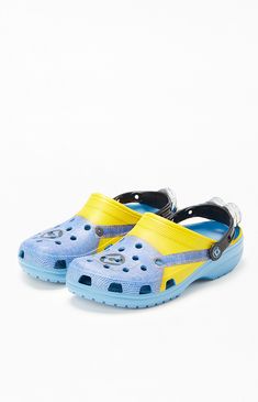 Step into trendsetting comfort with Crocs™ Despicable Me Classic Clogs! Featuring an EVA upper, insole, and outsole, these unlined, closed-toe slip-ons offer lightweight iconic Crocs comfort. Updated with a Minions design featuring an overall graphic and eye on the heel strap, these super cute clogs bring on comfort and style to your footwear collection.

PLEASE NOTE: This shoe is offered in men's sizes; please consult the Size Guide above - the conversion is two sizes smaller for women. For example, a woman who is a size 8 should order a size 6 in men's. 


	Incredibly lightweight
	Ventilation ports add breathability
	Exclusive Despicable Me printed design
	Easy to clean and quick to dry
	Pivoting heel straps for a more secure fit
	Iconic Crocs Comfort™: Lightweight. Flexible. Minions Design, Big Yellow Crocs, Slim Fit Cargo Pants, Crocs Sandals, High Heel Rain Boots, Swim Shoes, Kids Swimwear, Jeans Kids, Shoe Boot Sandals