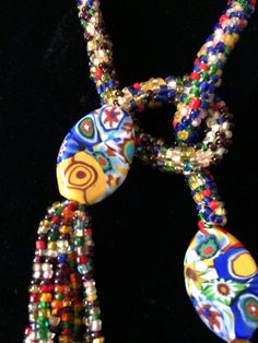 "Stunning lariat necklace from the 1920's with amazing beadwork and colors. In very good vintage vintage condition. Measurements are; From end to end 38 1/2\" Feel free to convo me with any further questions. Thank you for your interest." Vintage Adjustable Multicolor Necklaces, Beaded Multicolor Lariat Necklace For Gifts, Multicolor Beaded Lariat Necklace As A Gift, Multicolor Beaded Lariat Necklace For Gift, Vintage Multicolor Multi-strand Beads, Multicolor Beaded Lariat Necklace With Round Beads, Multicolor Beaded Lariat Necklace, Vintage Multicolor Beaded Jewelry, Unique Multicolor Lariat Necklace