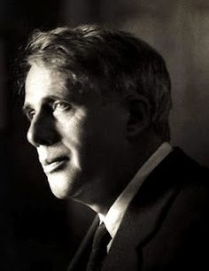 a black and white photo of a man in a suit looking off into the distance