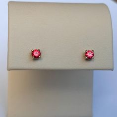 Ruby Stud Earrings Natural Rubies size: 3MM grade: AA color: red prong-set in 14K gold with push-back closures Very deep red, glowing and sparkly rubies. They are absolutely stunning! Rubies of this quality are becoming very rare and this is your chance to own a pair.  Perfect for a second piercing or to wear all on their own. Arrives thoughtfully packaged with a gift box and complimentary polishing cloth. Red Earrings For Anniversary, 14k Pink Gold Jewelry With Prong Setting, Classic Red Jewelry With Round Cut, Red Brilliant Cut Earrings For Anniversary, Classic Red Jewelry With Brilliant Cut, Pink Gold Earrings With Prong Setting For Anniversary, Anniversary Pink Gold Earrings With Prong Setting, Red Jewelry With Prong Setting For Formal Occasions, Classic Red Brilliant Cut Jewelry