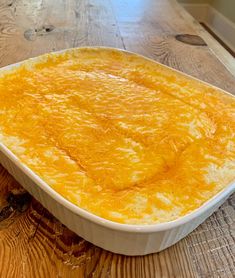 a casserole dish sitting on top of a wooden table