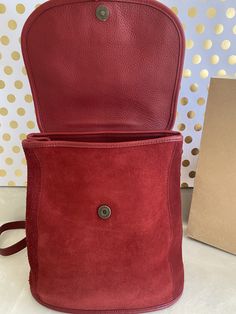 "Coach vintage berkeley convert backpack bag red pebbled leather & suede magnetic snap closure under flap large open compartment with zip pocket sides have snaps for expansion buckle adjustable strap - can double 38\" top hoop leather carrying handle addition zip pocket on exterior rear for quick easy access to essentials coach embossed hangtag solid brass hardware 12\"w x 12\"h x 6.5\"d made in the usa 1996 condition: bag is rare and hard to find especially in red! it has very light wears, Daily Use Burgundy Leather Backpack, Burgundy Leather Standard Backpack, Leather Backpack With Adjustable Strap In Burgundy, Leather Burgundy Backpack With Adjustable Strap, Leather Flap Bag With Snap Closure For Everyday Use, Burgundy Leather Backpack, Red Leather Flap Bag With Magnetic Closure, Burgundy Leather School Bag, Red Leather Backpack Shoulder Bag