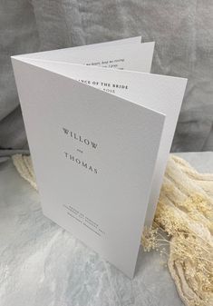 two white cards with the words willow and thomas on them