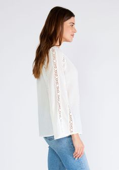 A classic bohemian top with crochet trim and long flared sleeves. Cotton Relaxed fit Long bell sleeves Split v-neckline Crochet trim Sheer Women's bohemian top The dreamiest top for any season. This classic bohemian blouse features long bell sleeves, a split v-neckline, and delicate crochet trim throughout. Perfect for warmer weather or layered for cooler days, it pairs beautifully with vintage denim and a simple sandal or boot. Model is 5'9, wearing a size S.Style: I-15321W-SQV Peasant Style V-neck Blouse For Brunch, Bohemian Cotton Peasant Top With Lace Trim, Chic Long Sleeve Tops With Cutwork Hem, Bohemian Tops With Lace Sleeves For Fall, Bohemian Flowy Top With Lace Trim, Bohemian V-neck Lace Top For Vacation, Summer Long Sleeve Tops With Cutwork Hem, Long Sleeve Summer Tops With Cutwork Hem, Cotton Crochet Top With Lace Trim And V-neck