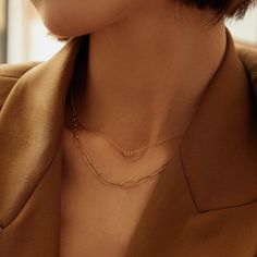 This modern necklace sets the stage for limitless glamour with its unique style. A sparkling round brilliant cut diamond is artistically placed in a paper clip halo pendant that is centered on a shiny rolo link chain. This design is a refreshing take on a timeless look with a contemporary edge that is perfect for day or night. Product Details: Material: 14K Solid Gold Chain Type: Cable Chain 0.9mm thickness Chain Length: 16 inches Extension Chain: 2 inches Pendant Dimension: 5.6mm*3.6mm Stone Ty Modern Diamond Necklace With Adjustable Chain, Elegant Gold Diamond Necklace With Paperclip Chain, Minimalist Jewelry With Paperclip Chain And Initial Pendant, Modern Diamond Necklace With Delicate Chain, Modern Diamond Necklace With Cable Chain, Minimalist Jewelry With Initial Pendant On Paperclip Chain, Modern Everyday Luxury Jewelry With Paperclip Chain, Minimalist Initial Pendant On Paperclip Chain, Minimalist Paperclip Chain With Initial Pendant