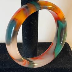 This Is A Beautiful Genuine Chalcedony Bangle Bracelet Hand Carved In Jade Style. About 2 1/4 Inch Inside Diameter, Or 58 Mm, It Is On The Small Side To Medium Side. The Chalcedony Is The Latest Sought After Natural Stone With Colors Of Blue, Red, Green Orange And Yellow. Each On Is One Of A Kind. It Is Semi-Translucent And Looks Like A Modern Art Nierman Painting. They Sell In The $100s. The Price Is Firm. Kate Spade Bangle, Purple Wrap, Engraved Cuff, Starfish Bracelet, Resin Bracelet, Gems Bracelet, Gold Bracelet Cuff, Elegant Bracelet, Glass Beaded Bracelets