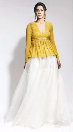 Yellow And White Organza Silk Peplum Top With Skirt Yellow Long Sleeve Dress For Reception, Elegant Fitted Peplum Lehenga, Elegant Long Yellow Skirt, Elegant Tiered Lehenga, Elegant Long Flowy Lehenga, Elegant Long Skirt Lehenga For Spring, Elegant Flowy Long Skirt Lehenga, Elegant Spring Lehenga, Elegant Long Flowy Lehenga Skirt