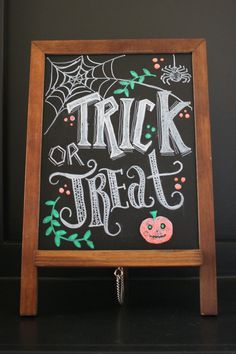 a trick or treat sign on a blackboard