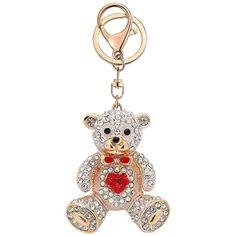 a key chain with a teddy bear holding a heart on it's chest,