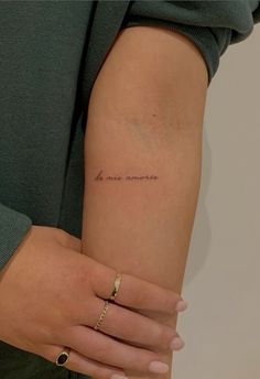 a woman with a small tattoo on her arm