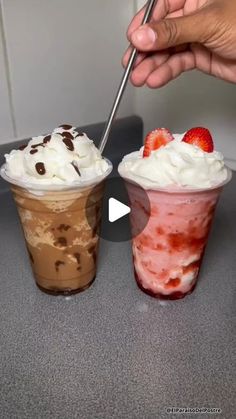 two drinks with whipped cream and strawberries in them