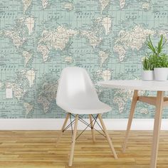 a table and chair in front of a wall with a world map on the wall