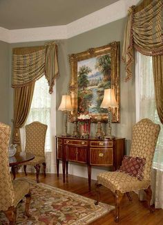 a living room filled with furniture and curtains