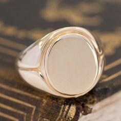 This vintage signet ring from the famed house Tiffany & Co. is big, bold, and gold - three of our favorite things here at JbyG. The 14kt gold is such a warm and buttery tone, and when worn, the ring feels like armor on the finger! The top of the ring is blank and ready to be engraved with a message or image of your choosing - or leave her blank and let your daily life leave its mark! 14kt Yellow Gold Size 9.75 & fully resizable Please see qualitative report for more information. Modern Mens Rings, Art Jewelry Earrings, Bespoke Rings, Antique Watches, Gold Signet Ring, Antique Engagement, Loose Stones, Antique Engagement Rings, Vintage Band