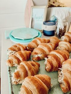 there are many croissants on the table ready to be eaten and served