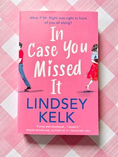 the book in case you missed it by lindsey kelk is laying on a pink checkered tablecloth