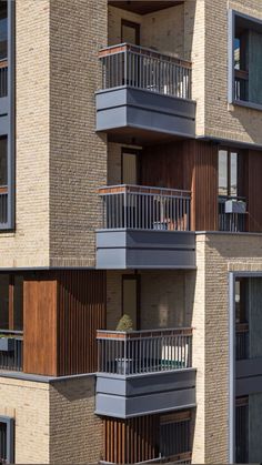 an apartment building with balconies and balcony railings