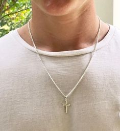 Description This is the perfect, classic sterling silver cross necklace for a man, teenager or even a boy. It is slightly smaller than the Classic Sterling Men's Cross, and is created with clean and simple lines. It features a strong, sterling silver cable chain. Just choose your length. The model is wearing a 20 inch chain. This simple but masculine cross measures 1” x 1/2” and would make a perfect gift for a confirmation, baptism or graduation. It is a classic cross that he will love and be ab Men's Cross Necklace, Classic Everyday Cross Pendant Necklace, Everyday Classic Cross Pendant Necklace, Classic Everyday Cross Necklace, Boys Cross Necklace, Confirmation Gifts For Boys, Cross Necklace Men, Necklace For Boys, Boy Necklace