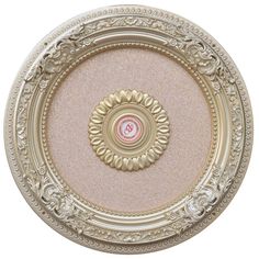 an ornately decorated ceiling medallion in gold and pink with white trim on the center