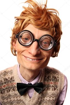 a man with glasses and a bow tie is smiling at the camera while wearing a sweater vest