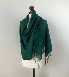 "This emerald green pashmina scarf is made of cotton fabric. This boho tassel shawl will look very elegant on your shoulders. Also, it is a perfect gift idea for your mother. The oversized green bridal scarf is stunning. This wrap pashmina is a brilliant and priceless gift idea. Are you looking for a personalized gift for your bridesmaid? This long forest green pashmina shawl would be suitable for bridal events. You can wrap it around your neck or shoulder-in. If you wish, initials can be added Shawls And Wraps Formal Green, Green Pashmina Shawl For Wedding, Green Pashmina Shawl In Traditional Drape, Elegant Green Pashmina Shawl, Elegant Green Pashmina Shawl For Weddings, Traditional Green Shawl For Wedding, Green Pashmina Shawl Scarf, Green Pashmina Shawl For Winter, Green Pashmina Scarves For Winter