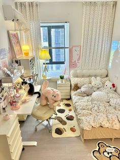 a bedroom with a bed, desk and stuffed animals