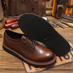 Revitalize your wardrobe with these men's Oxford shoes, featuring a round toe and thick soles for added style. Crafted from genuine leather, the lace-up closure ensures a secure fit. The pigskin insole and rubber outsole offer comfort for daily wear. Don't miss the chance to elevate your style with this perfect blend of retro charm and modern comfort. Grab yours now and step into fashion-forward confidence! Specifications Brand Name: GeraldBlack Shoes Type: BasicOrigin: Mainland ChinaSeason: Spring/AutumnUpper Material: Genuine LeatherUpper-Genuine Leather Type: Cow LeatherFit: Fits true to size, take your normal sizeModel Number: SHOE-TR-2477Closure Type: Lace-upItem Type: OxfordsFashion Element: SewingDepartment Name: AdultOutsole Material: RubberPattern Type: SolidFeature: BreathableFea Masculine Brown Lace-up Oxfords, Classic Brown Leather Shoes With Lug Sole, Leather Moc Toe Oxfords With Lug Sole, Leather Oxfords With Moc Toe And Lug Sole, Derby Lace-up Shoes With Round Toe And Lug Sole, Brown Lace-up Oxfords With Goodyear Welt Construction, Masculine Leather Lace-up Oxfords, Leather Lace-up Shoes With Lug Sole And Round Toe, Business Lace-up Shoes With Lug Sole