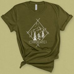 Adventure awaits t-shirt for women is the perfect camping tee with a rustic nostalgic feel. Wear this mountains graphic tee while enjoying nature and the great outdoors graphic. Grab your gear and head out in your new backpacking shirt this summer! DETAILS This Beautiful graphic t-shirt is made of 49% to 100% combed and ring-spun cotton and is very soft and comfortable to wear. Check the size card for specific fabrications per color. We use DTG technology and eco friendly inks allowing us to pro Mountains Graphic, Mountain Graphic Tee, Summer Details, Enjoying Nature, Camping Tee, Cut Tees, Adventure Shirt, T Shirt For Women, Better Love