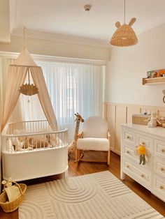 a baby's room with a crib, dresser and bed