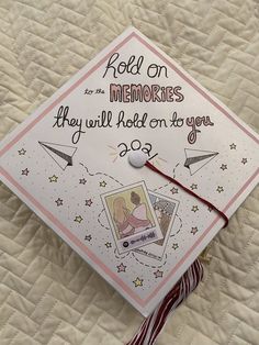 a white graduation cap with writing on it that says, roll on memories they will hold on to you