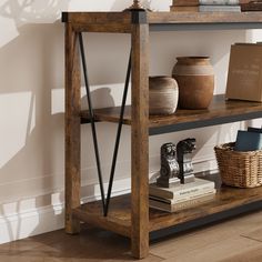 a wooden shelf with books and vases on it