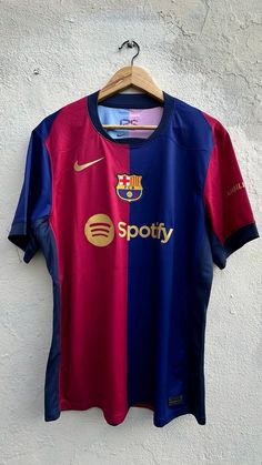 a soccer jersey hanging on a wall