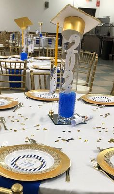 I spent $165 and make a total of 12 centerpieces" including the tall vase and glass mirror Blue Graduation Centerpieces, Graduation Party Centerpiece Ideas, Party Centerpiece Ideas, Grad Party Centerpieces, Grad Party Decor, Blue Graduation Party, Nursing School Graduation Party, Graduation Party Table