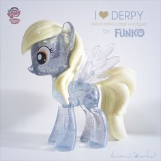 the little pony has blonde hair and is wearing white wings on it's head