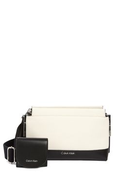 Blocky coloring draws the eye to this structured crossbody bag that's topped with convertible straps to customize your look. 9 1/2"W x 6 1/2"H x 3 1/2"D; 23" strap drop Synthetic Imported The Eye, Cross Body Handbags, Nordstrom Rack, Convertible, White Black, Calvin Klein, Crossbody Bag, White And Black, Women Handbags