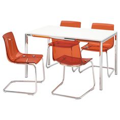 an orange and white table with four chairs