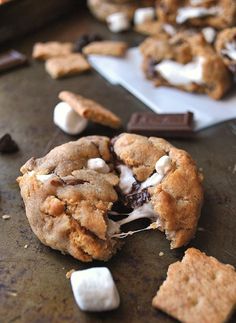 cookies with marshmallows and chocolate chips are on the table next to each other