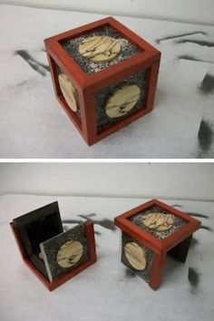 two different views of a wooden box with sand in it