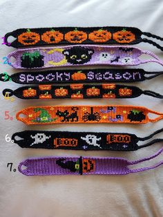 four halloween lanyards with different designs on them